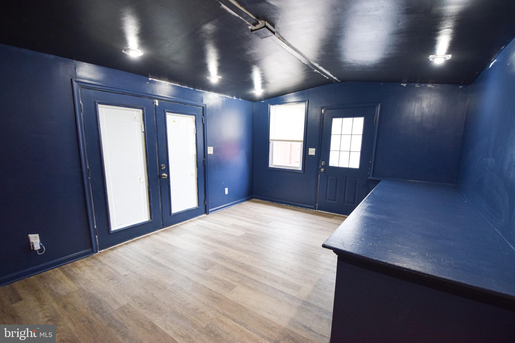 6419 Marietta Avenue Baltimore, MD 21214 - Photo 13 of 38 an empty room with windows