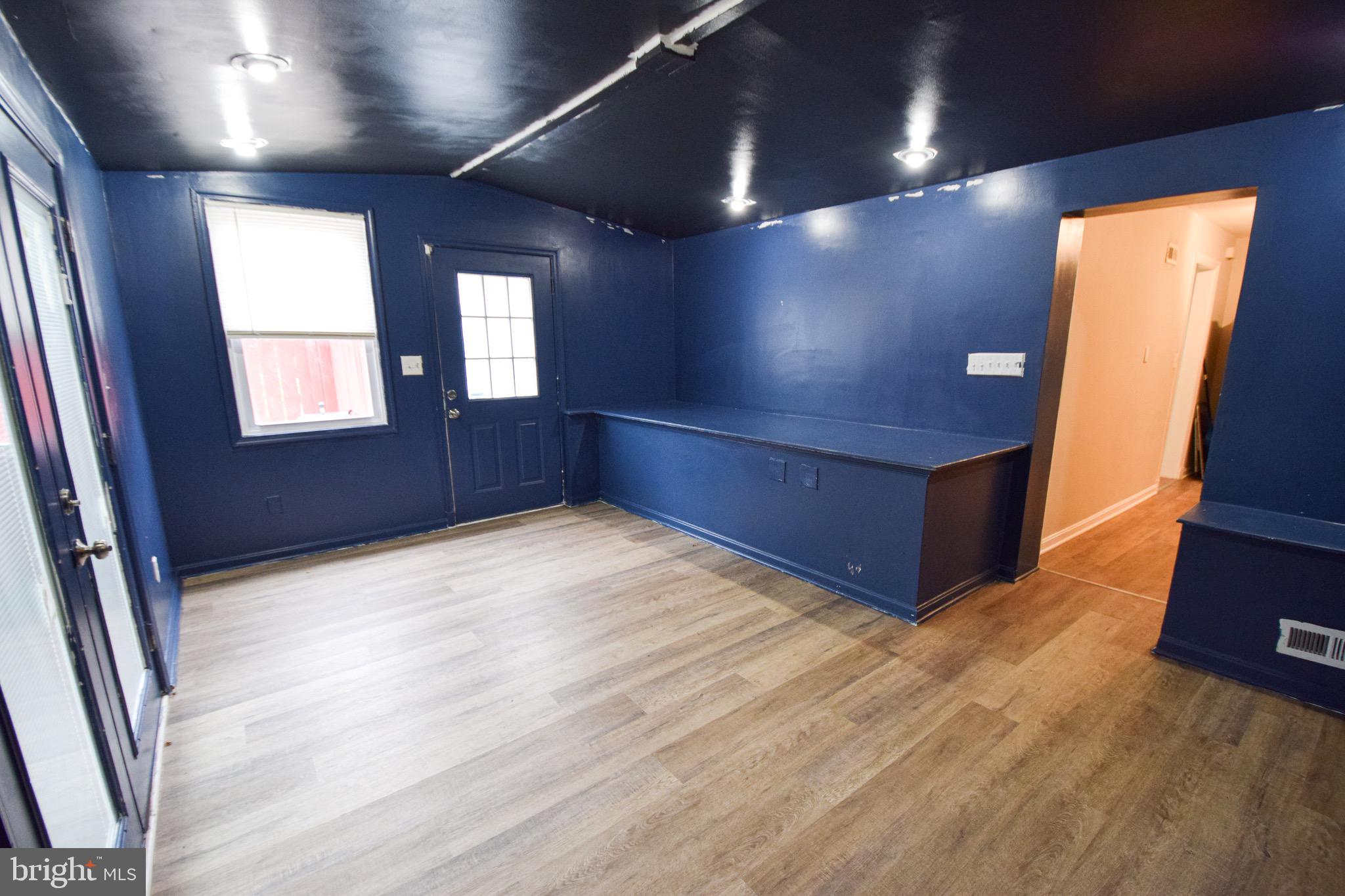 6419 Marietta Avenue Baltimore, MD 21214 - Photo 14 of 38 an empty room with windows