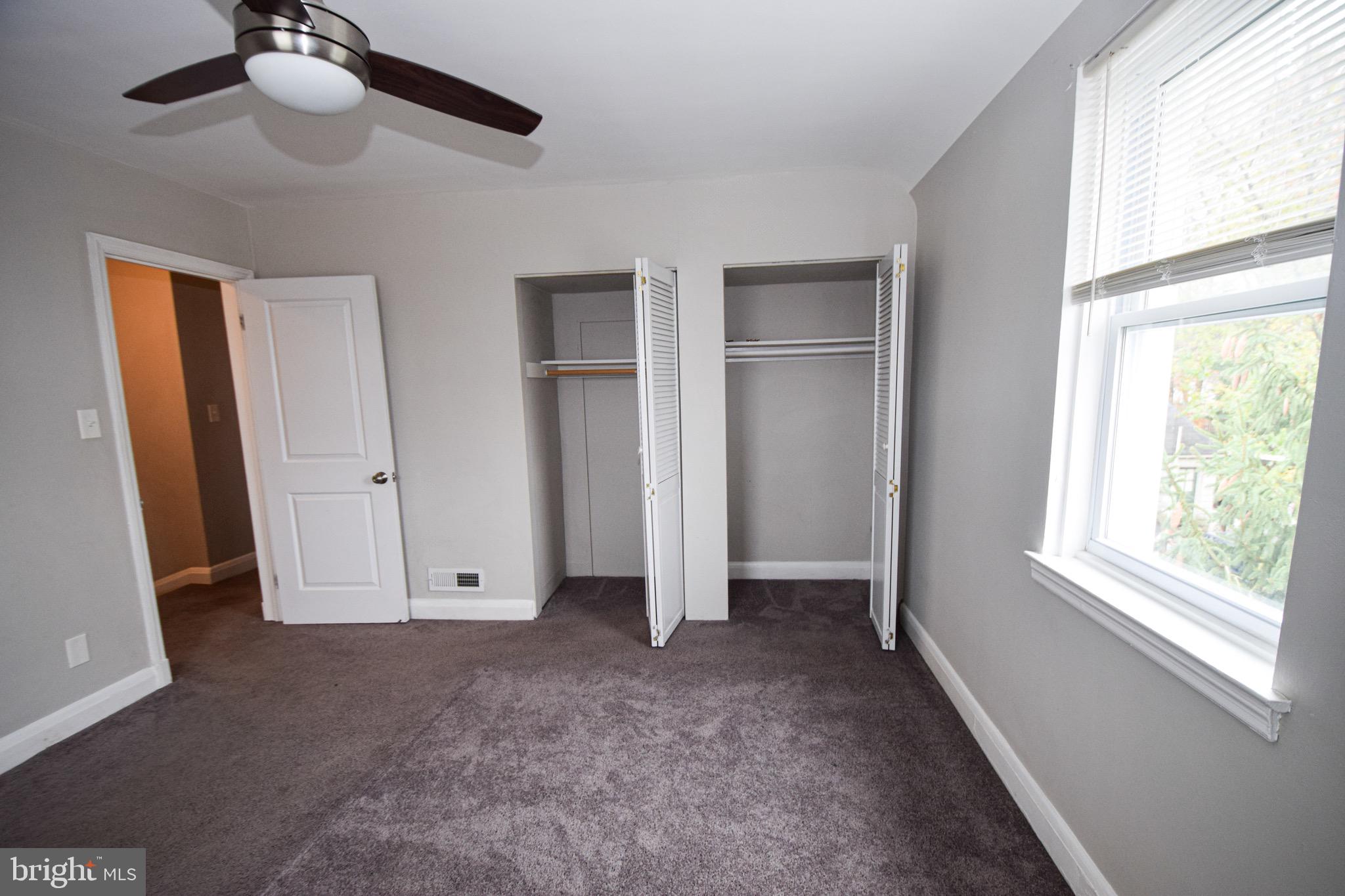 6419 Marietta Avenue Baltimore, MD 21214 - Photo 17 of 38 an empty room with windows and closet