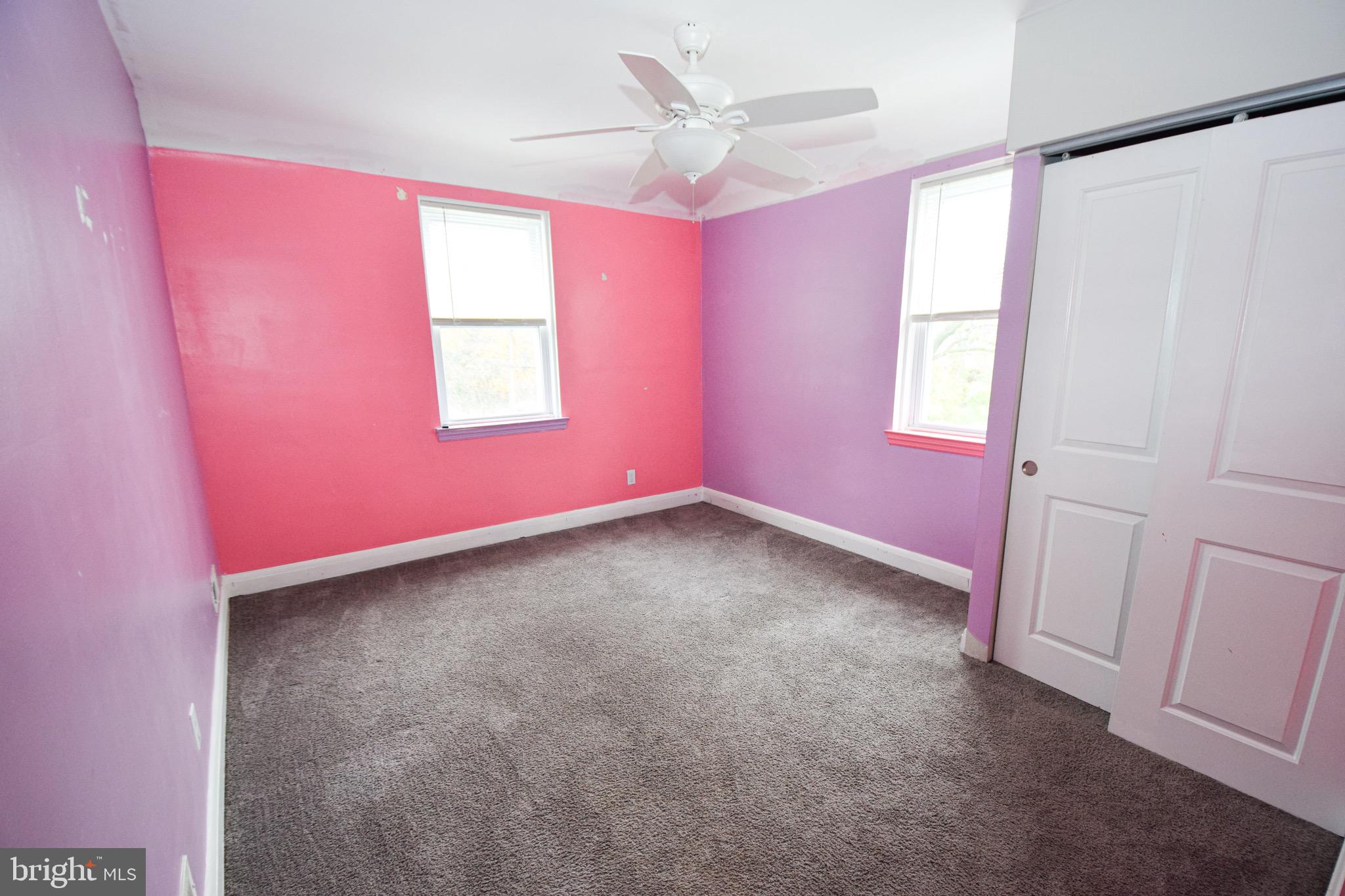6419 Marietta Avenue Baltimore, MD 21214 - Photo 18 of 38 an empty room with windows and fan