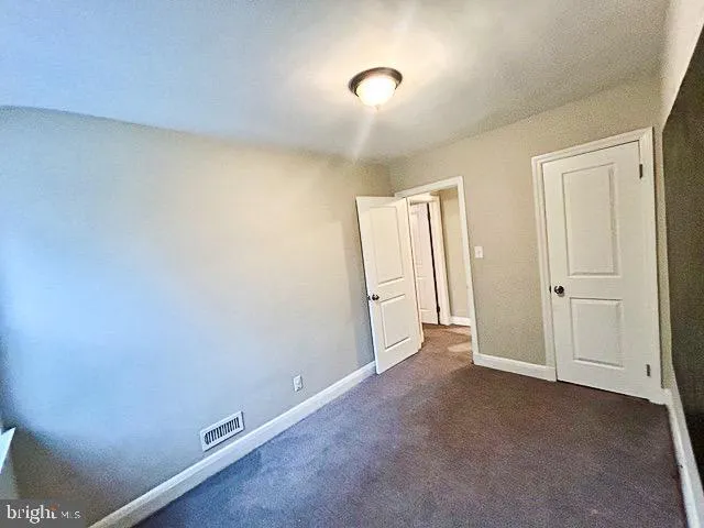 a bathroom with a tub a sink a mirror and a shower