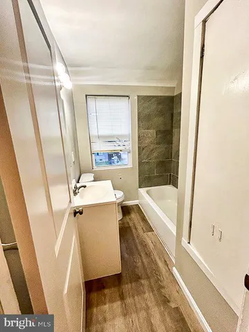 a bathroom with a bathtub and shower