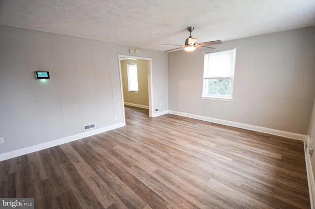 a view of backyard with a deck and wooden floor
