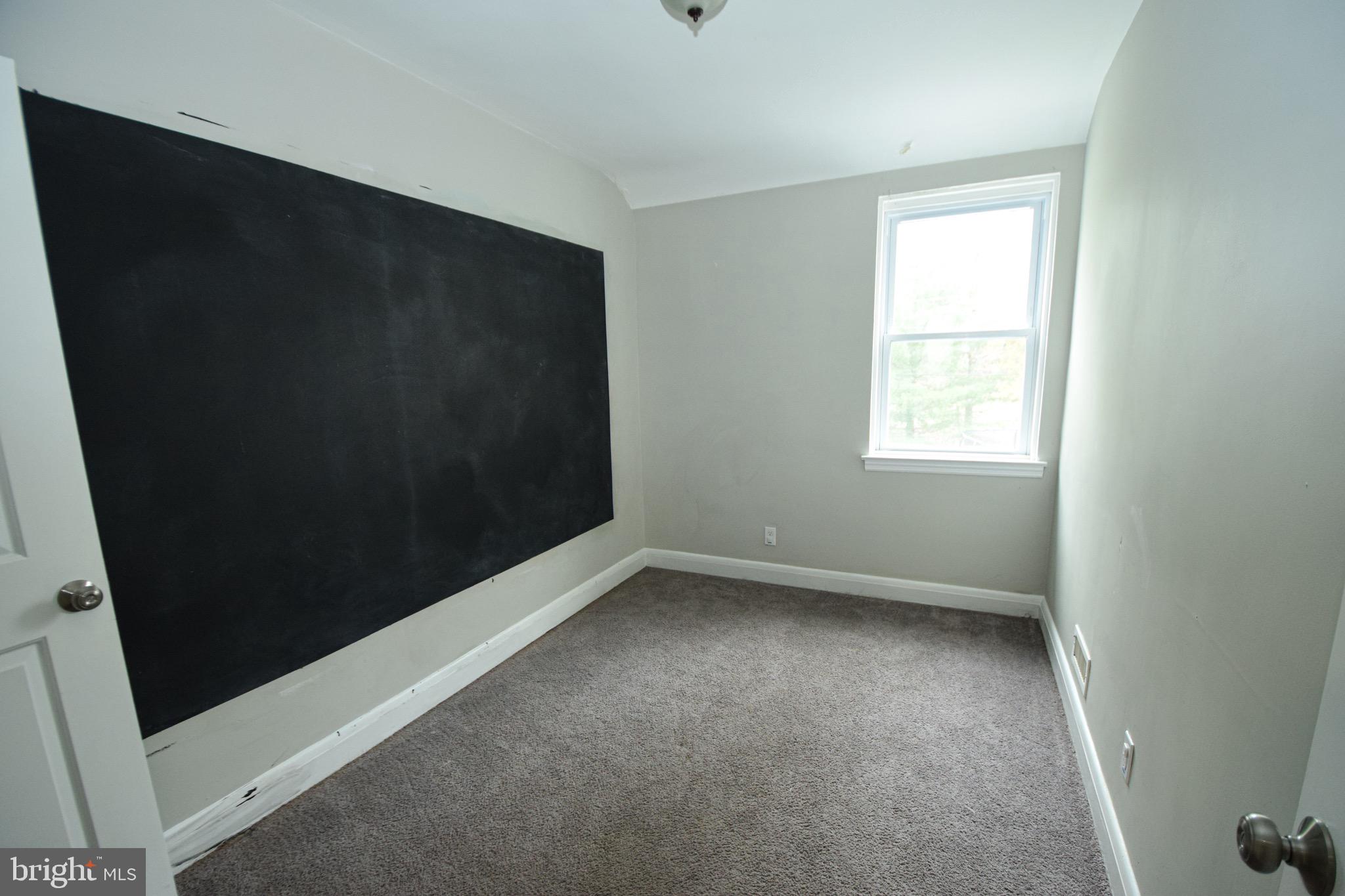 6419 Marietta Avenue Baltimore, MD 21214 - Photo 23 of 38 an empty room with a window