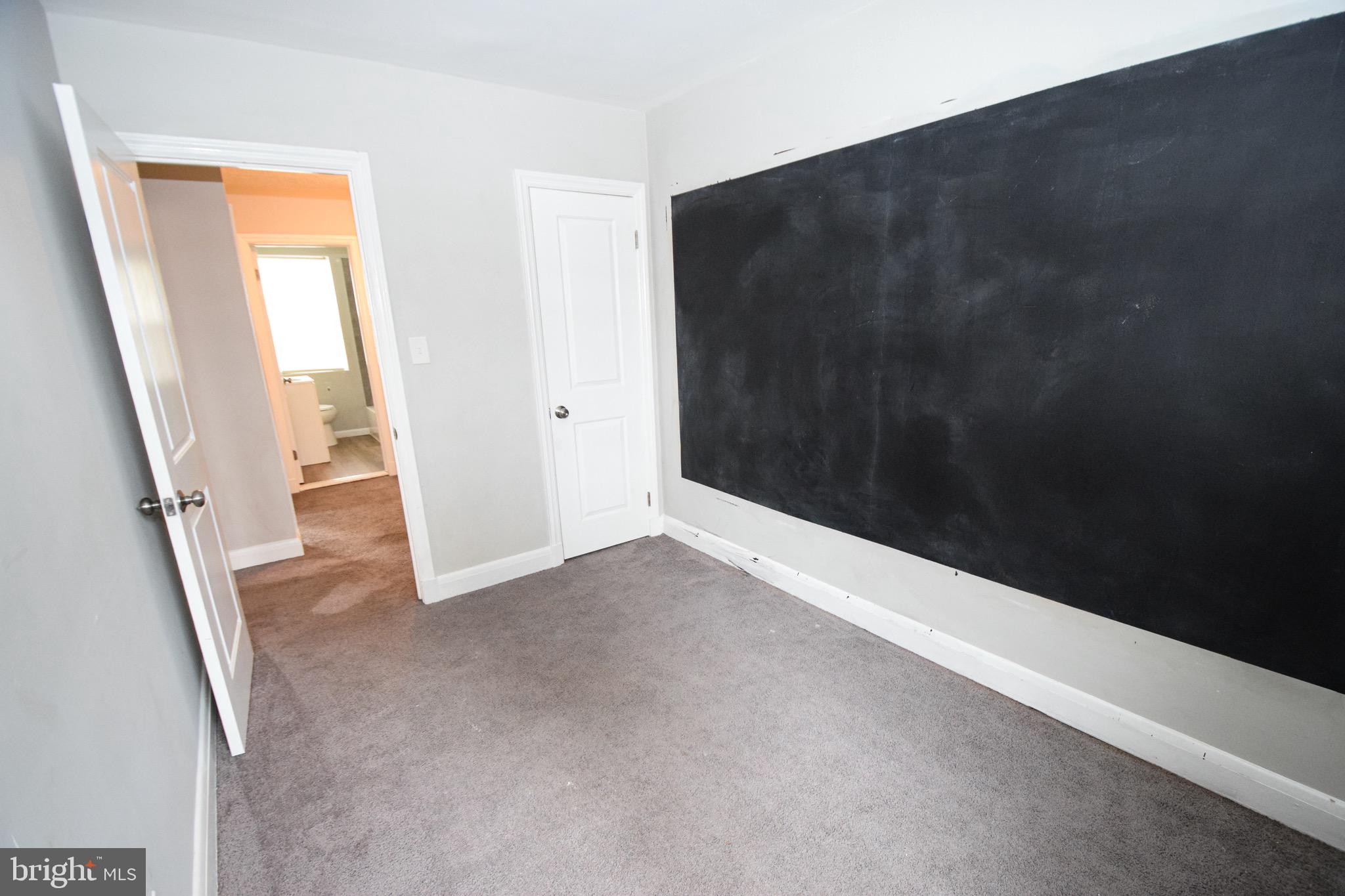 6419 Marietta Avenue Baltimore, MD 21214 - Photo 24 of 38 a view of an empty room with a window