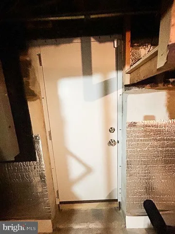 a view of a patio with a table and chairs