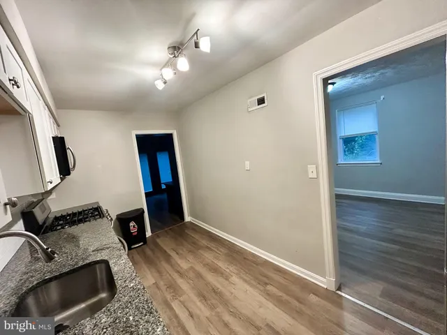 a view of a hallway with a workspace