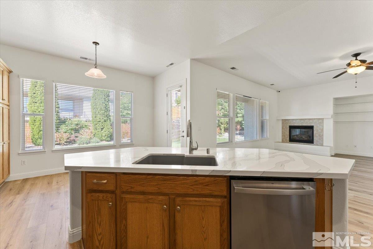 3259 Diamond Ridge Drive Reno, NV 89523 - Photo 15 of 40 a kitchen with granite countertop a sink and a window