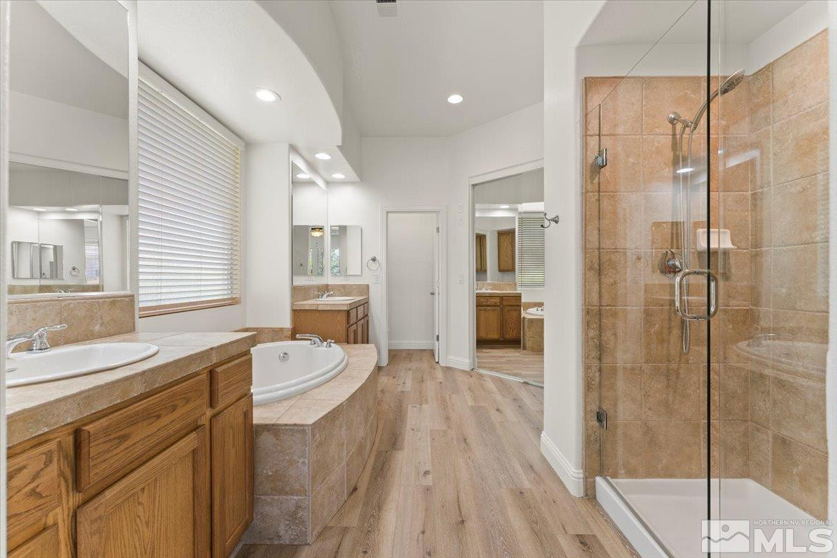 3259 Diamond Ridge Drive Reno, NV 89523 - Photo 20 of 40 a bathroom with a sink a toilet a mirror and shower