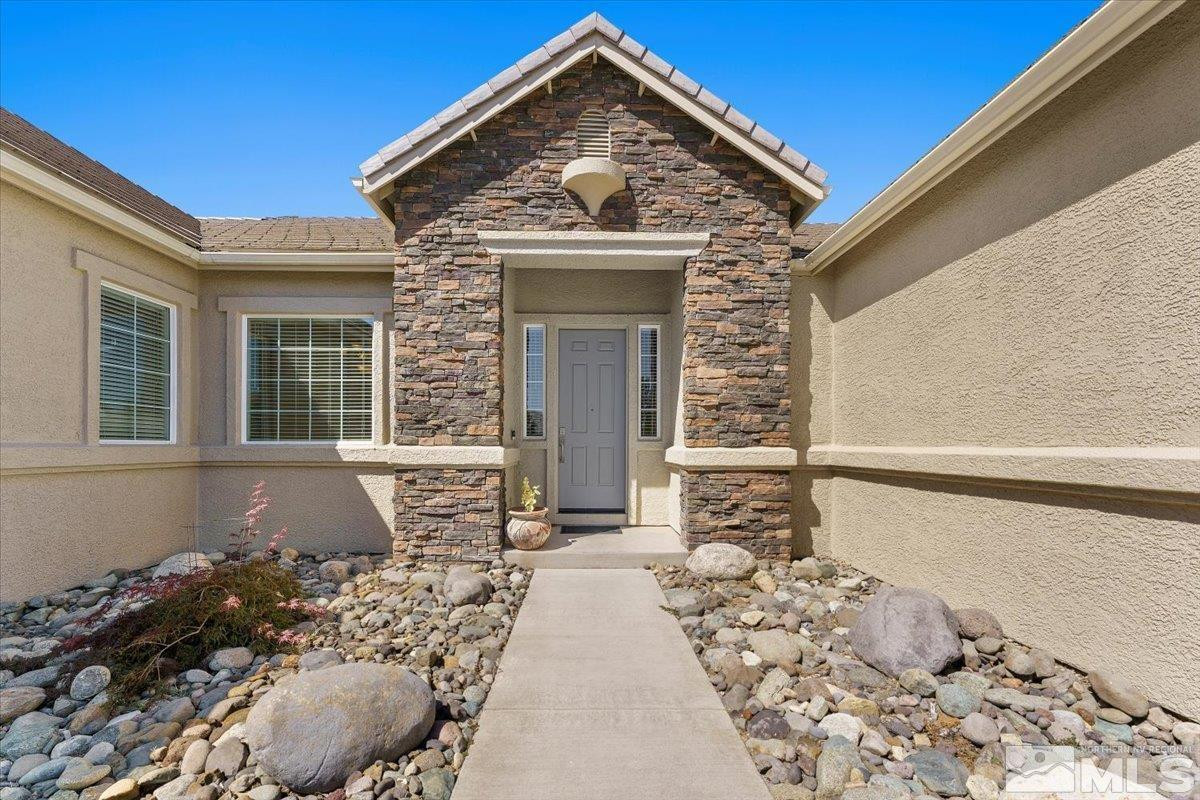 3259 Diamond Ridge Drive Reno, NV 89523 - Photo 35 of 40 a front view of a house with a yard