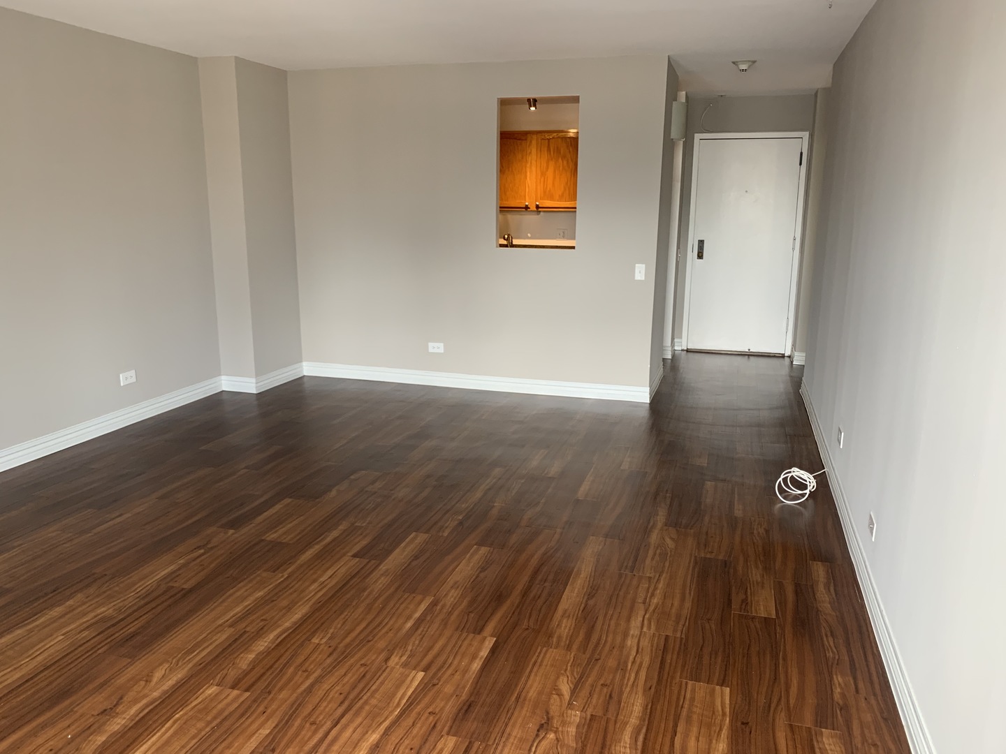 100 West Chestnut Street, Unit 3008 Chicago, IL 60610 - Photo 5 of 14 a view of a room with wooden floor and a ceiling fan