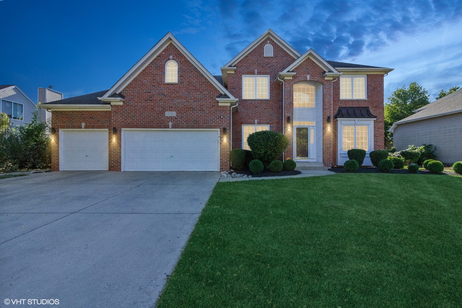 13765 Capista Drive Plainfield, IL 60544 - Photo 19 of 19 a front view of a house with a yard and garage
