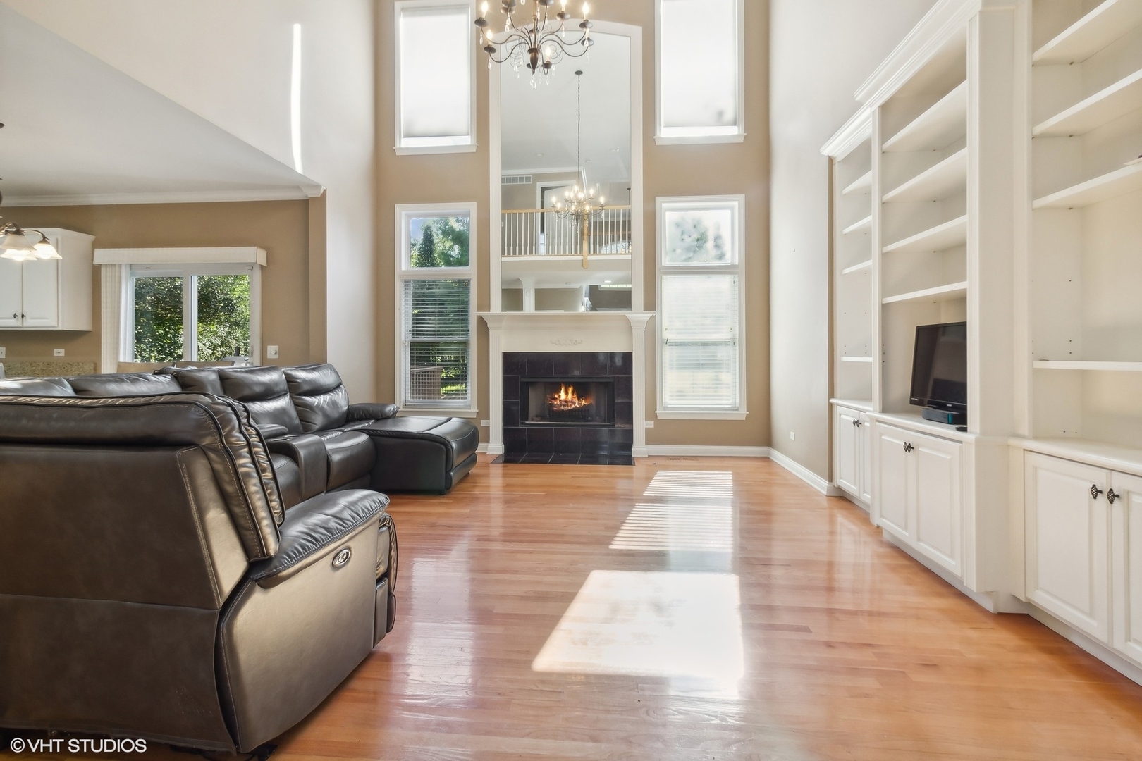 13765 Capista Drive Plainfield, IL 60544 - Photo 3 of 19 a living room with furniture and a fireplace