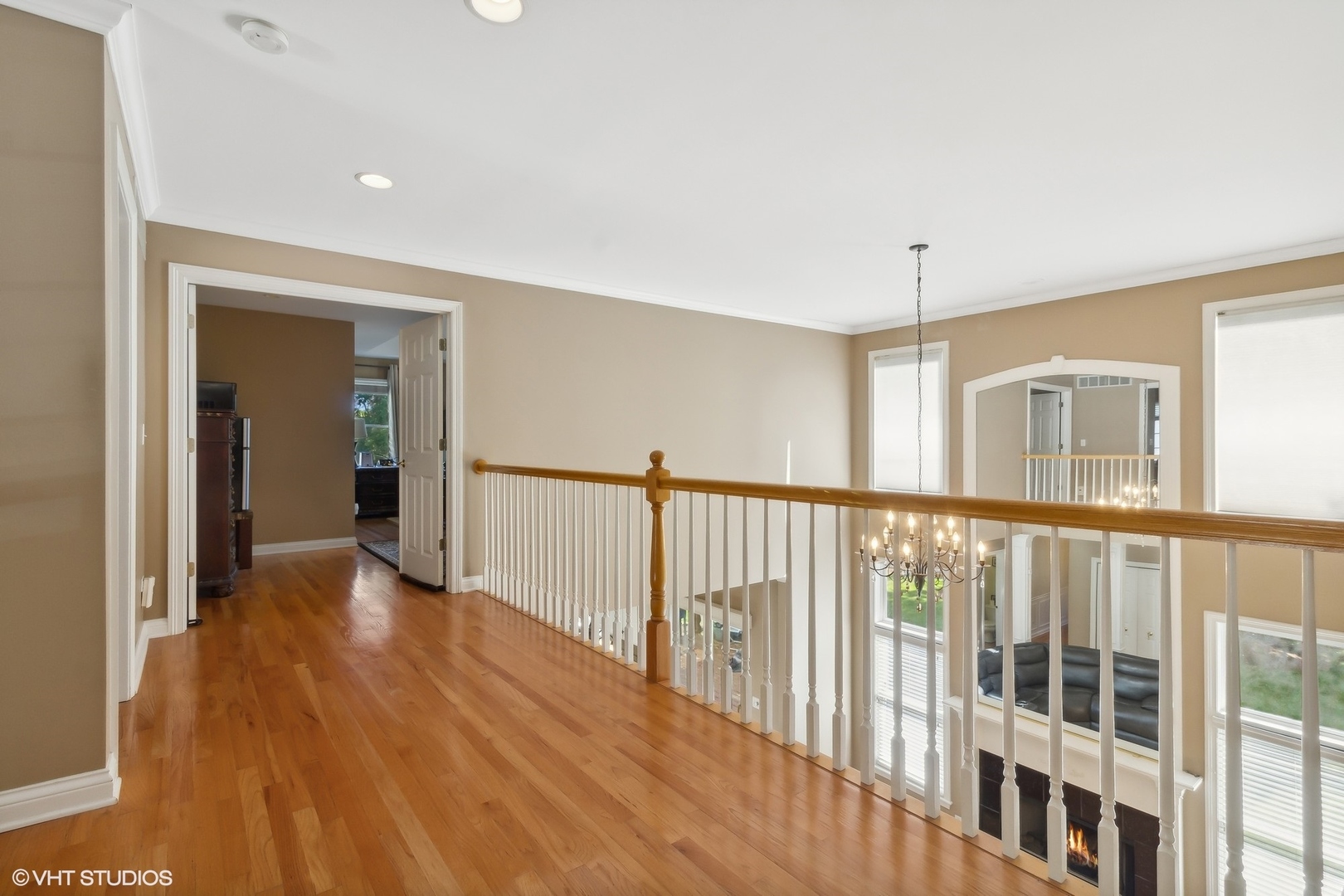 13765 Capista Drive Plainfield, IL 60544 - Photo 10 of 19 a view of a hallway with wooden floor and windows