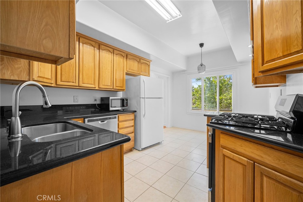 216 East Windsor Road, Unit 2 Glendale, CA 91205 - Photo 11 of 20 a kitchen with stainless steel appliances granite countertop a sink stove and refrigerator