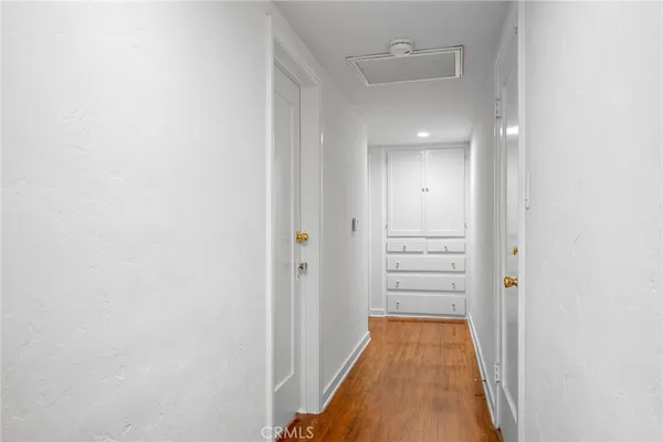 a view of a hallway with closet