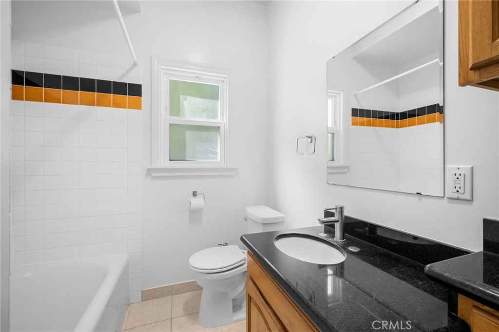 216 East Windsor Road, Unit 2 Glendale, CA 91205 - Photo 15 of 20 a bathroom with a sink and a mirror
