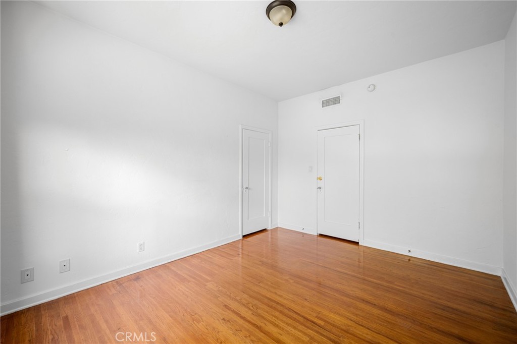 216 East Windsor Road, Unit 2 Glendale, CA 91205 - Photo 18 of 20 an empty room with wooden floor