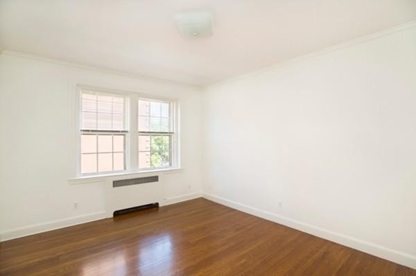 92 Beacon Street, Unit 41 Boston, MA 02108 - Photo 3 of 8 an empty room with wooden floor and windows