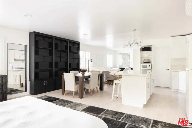 a living room with furniture a window and a table