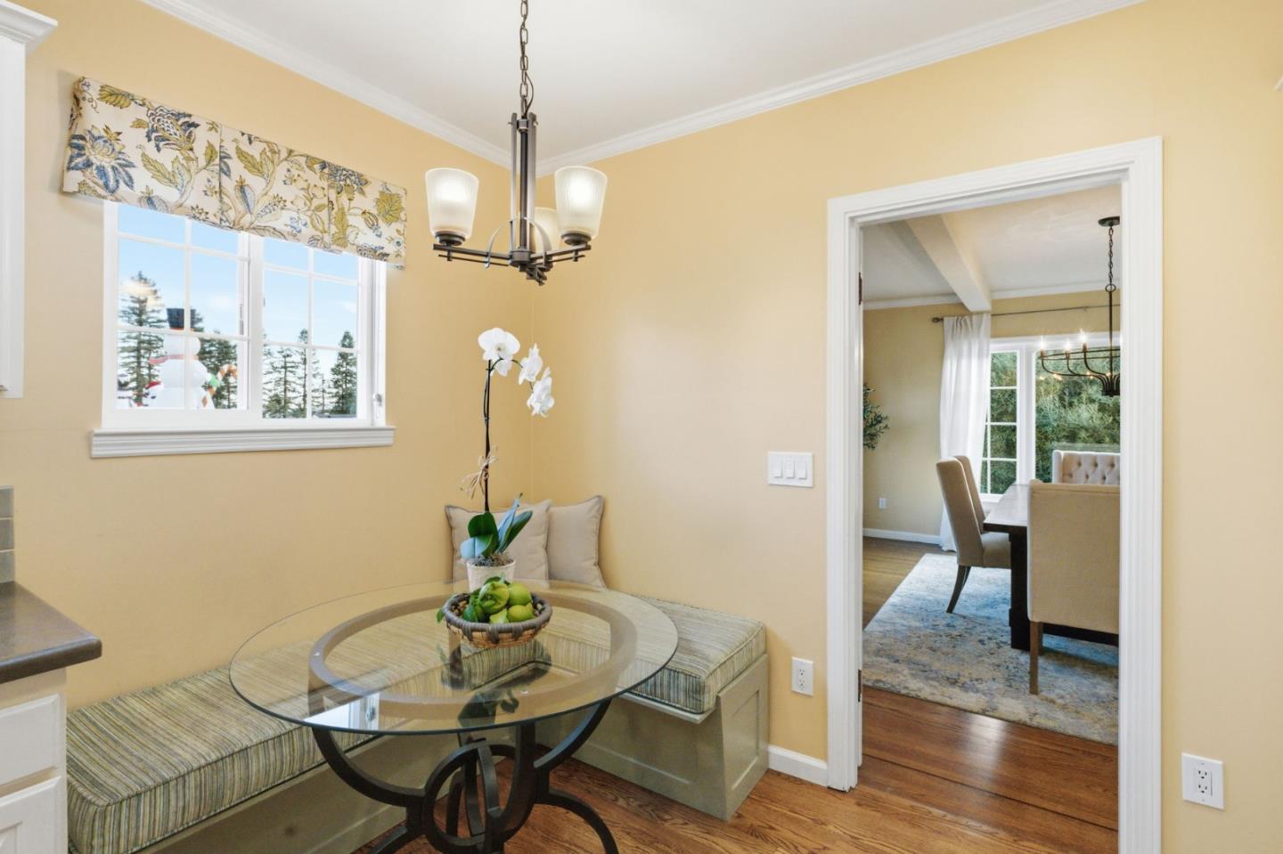 418 Ridge Road San Carlos, CA 94070 - Photo 17 of 64 a view of a dining room with furniture wooden floor and a chandelier