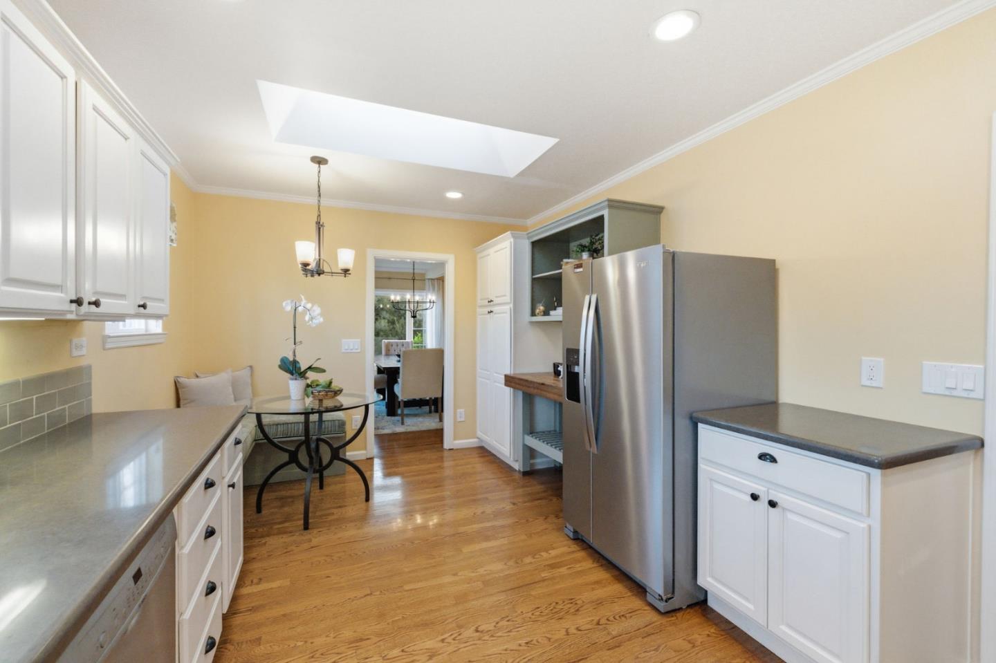 418 Ridge Road San Carlos, CA 94070 - Photo 20 of 64 a kitchen with stainless steel appliances kitchen island granite countertop a refrigerator and a stove top oven
