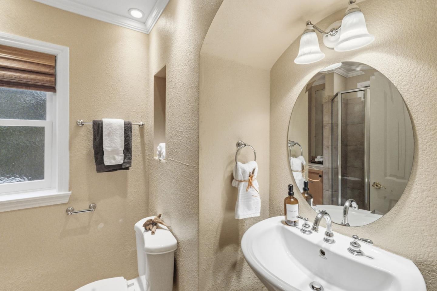 418 Ridge Road San Carlos, CA 94070 - Photo 46 of 64 a bathroom with a toilet sink and mirror