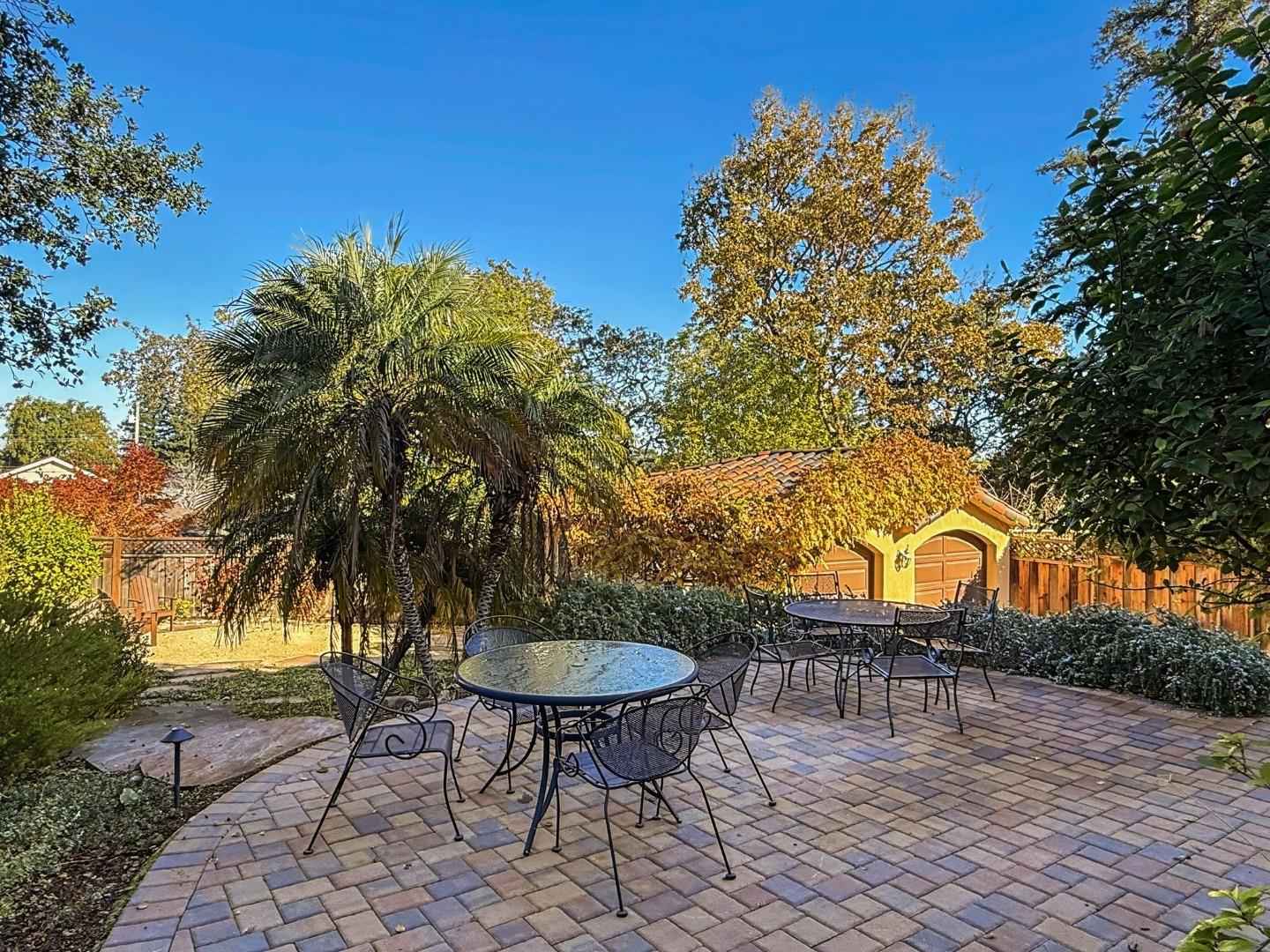 418 Ridge Road San Carlos, CA 94070 - Photo 51 of 64 a backyard of a house with table and chairs