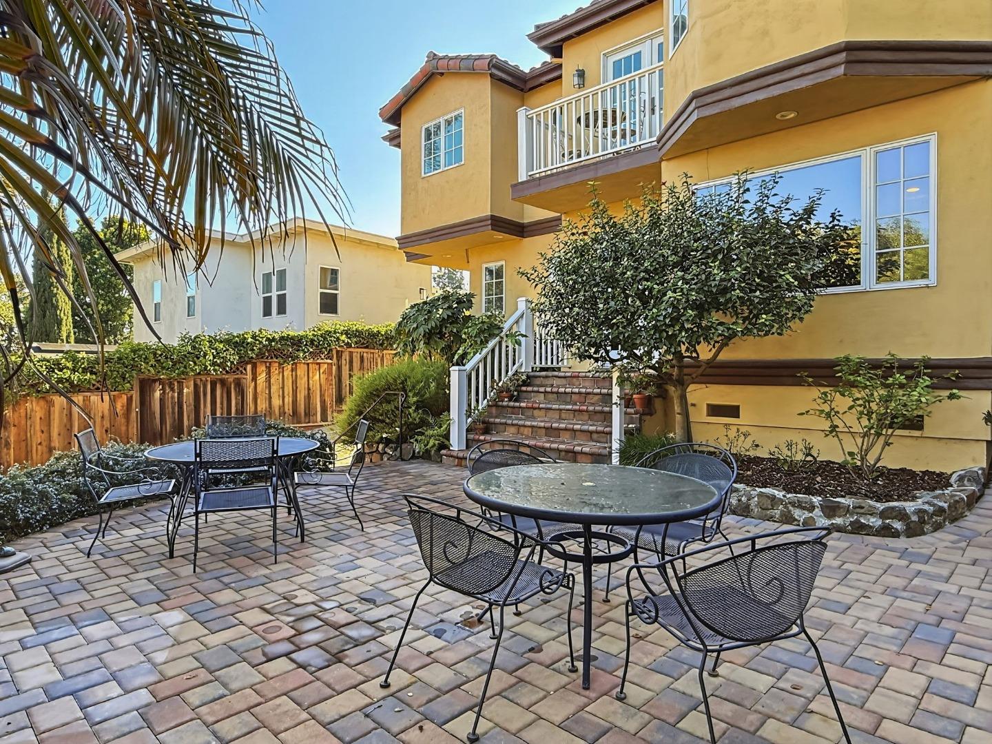 418 Ridge Road San Carlos, CA 94070 - Photo 52 of 64 a backyard of a house with barbeque oven table and chairs