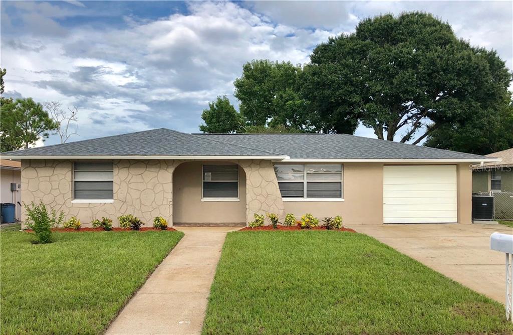 8916 Tropical Palm Way Port Richey, FL 34668 - Photo 1 of 1 New landscaping and sod in the front yard.