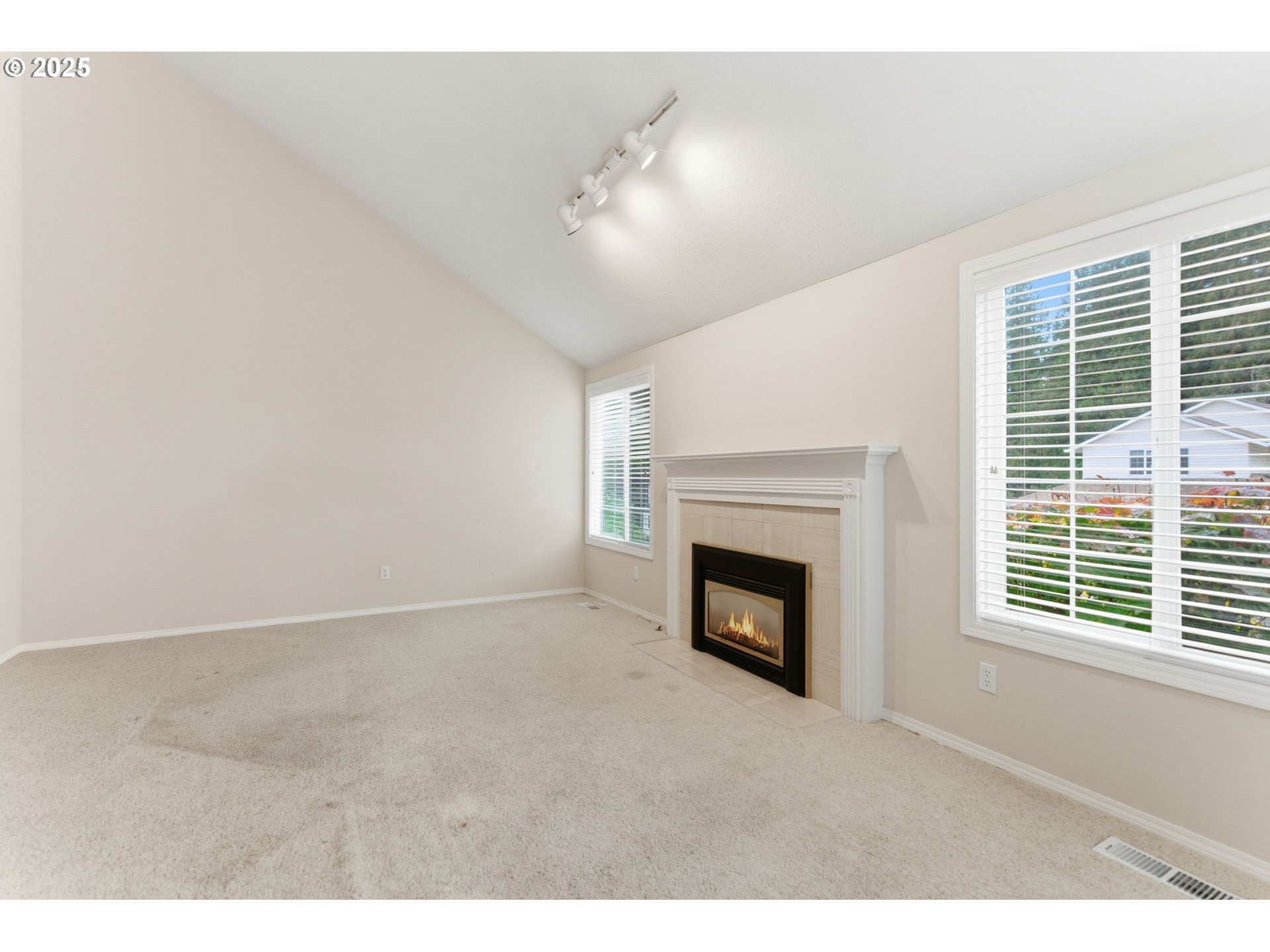 4753 Southeast 14th Street Gresham, OR 97080 - Photo 15 of 48 a view of an empty room with a fireplace and a window