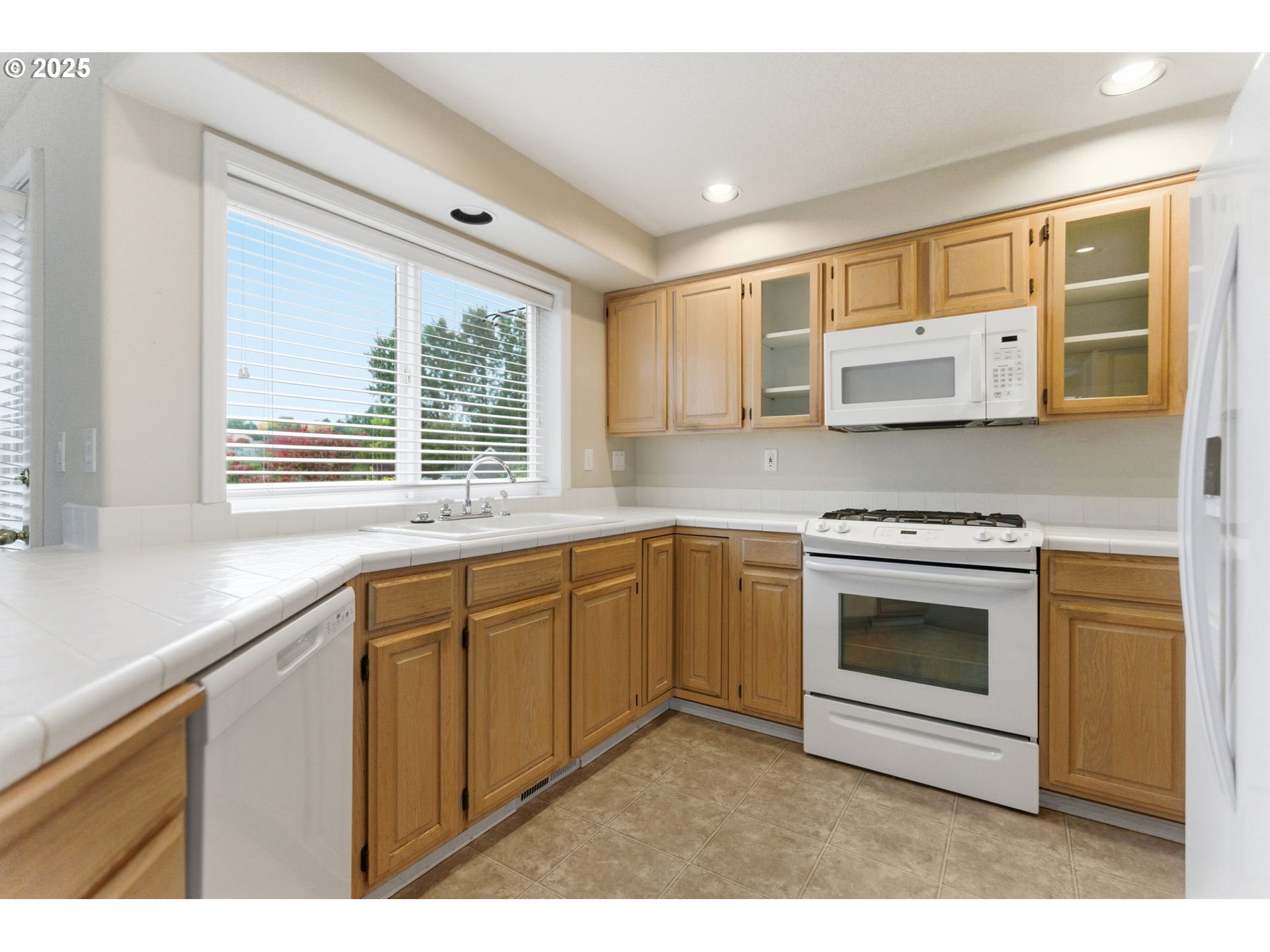 4753 Southeast 14th Street Gresham, OR 97080 - Photo 19 of 48 a kitchen with stainless steel appliances granite countertop a stove and a sink