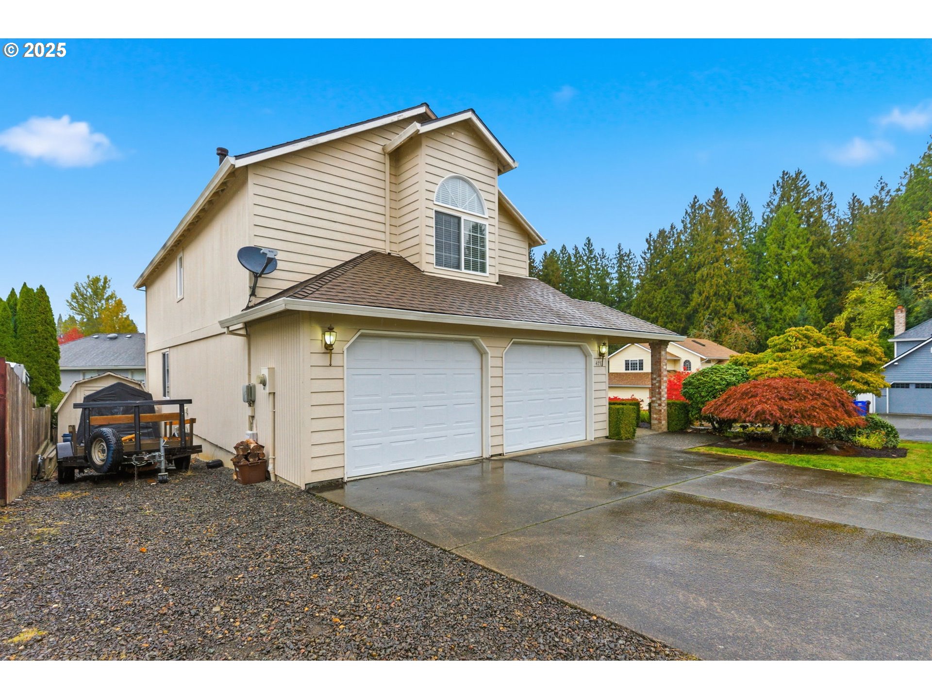 4753 Southeast 14th Street Gresham, OR 97080 - Photo 2 of 48 a front view of a house with a yard and garage