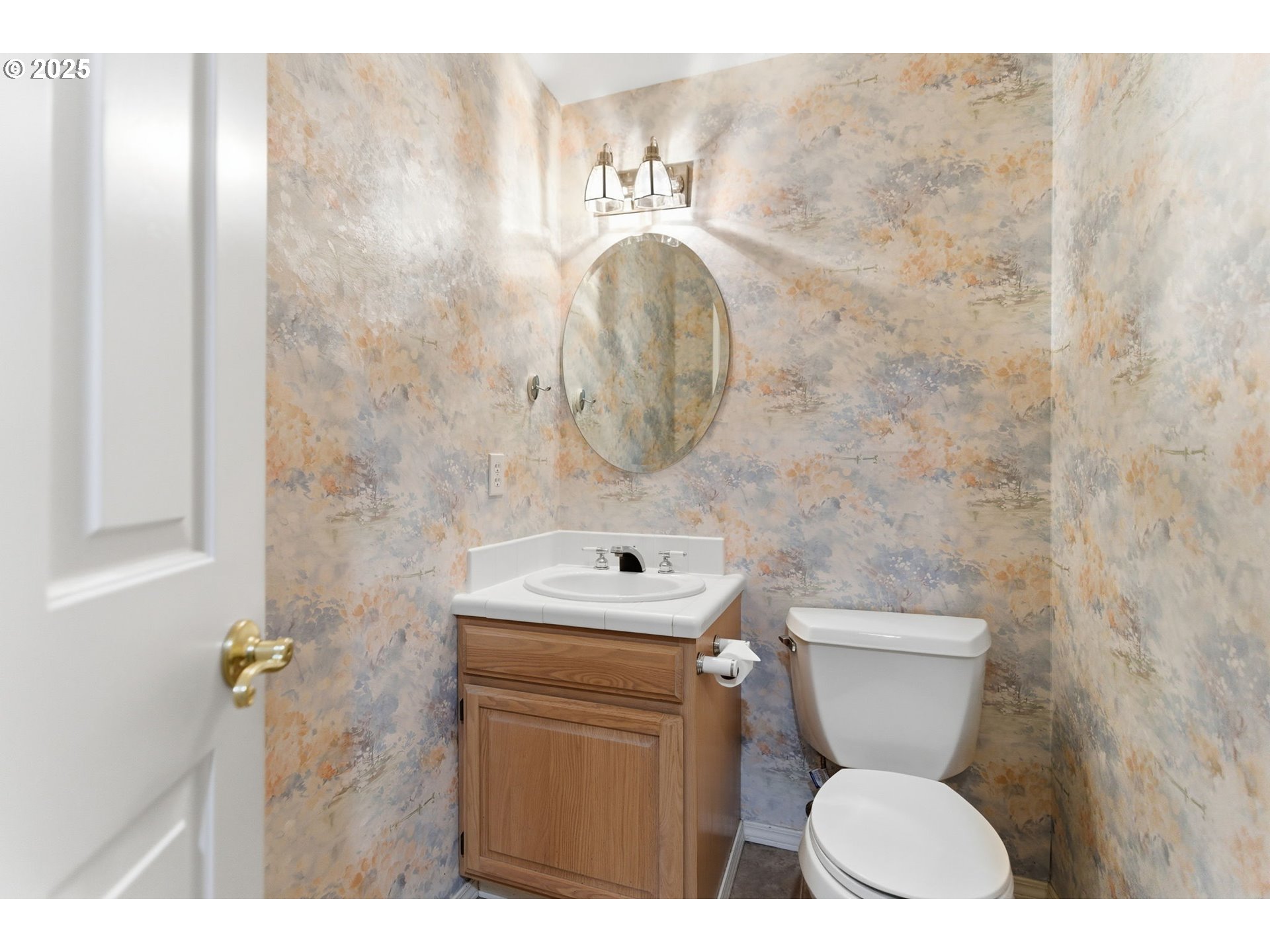 4753 Southeast 14th Street Gresham, OR 97080 - Photo 27 of 48 a bathroom with a toilet a sink and mirror