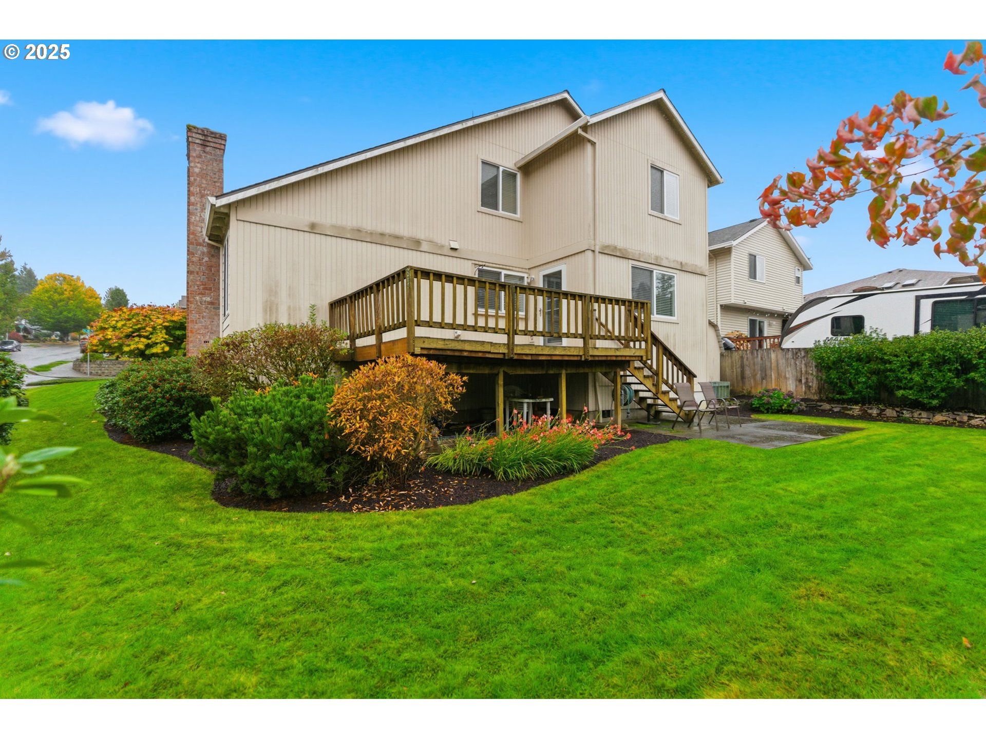 4753 Southeast 14th Street Gresham, OR 97080 - Photo 40 of 48 a view of a white house with a big yard and large trees