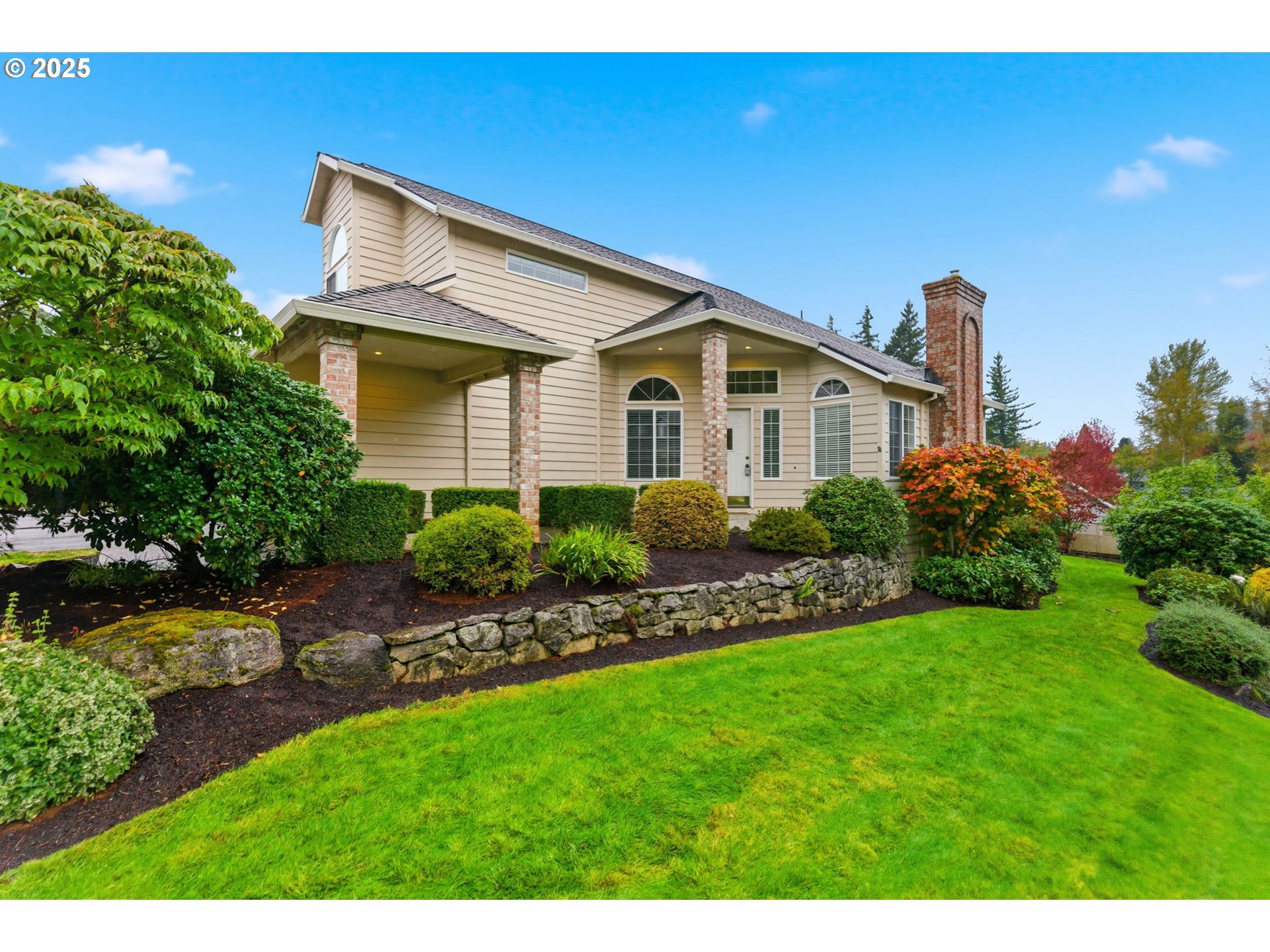 4753 Southeast 14th Street Gresham, OR 97080 - Photo 42 of 48 a front view of a house with a garden and plants
