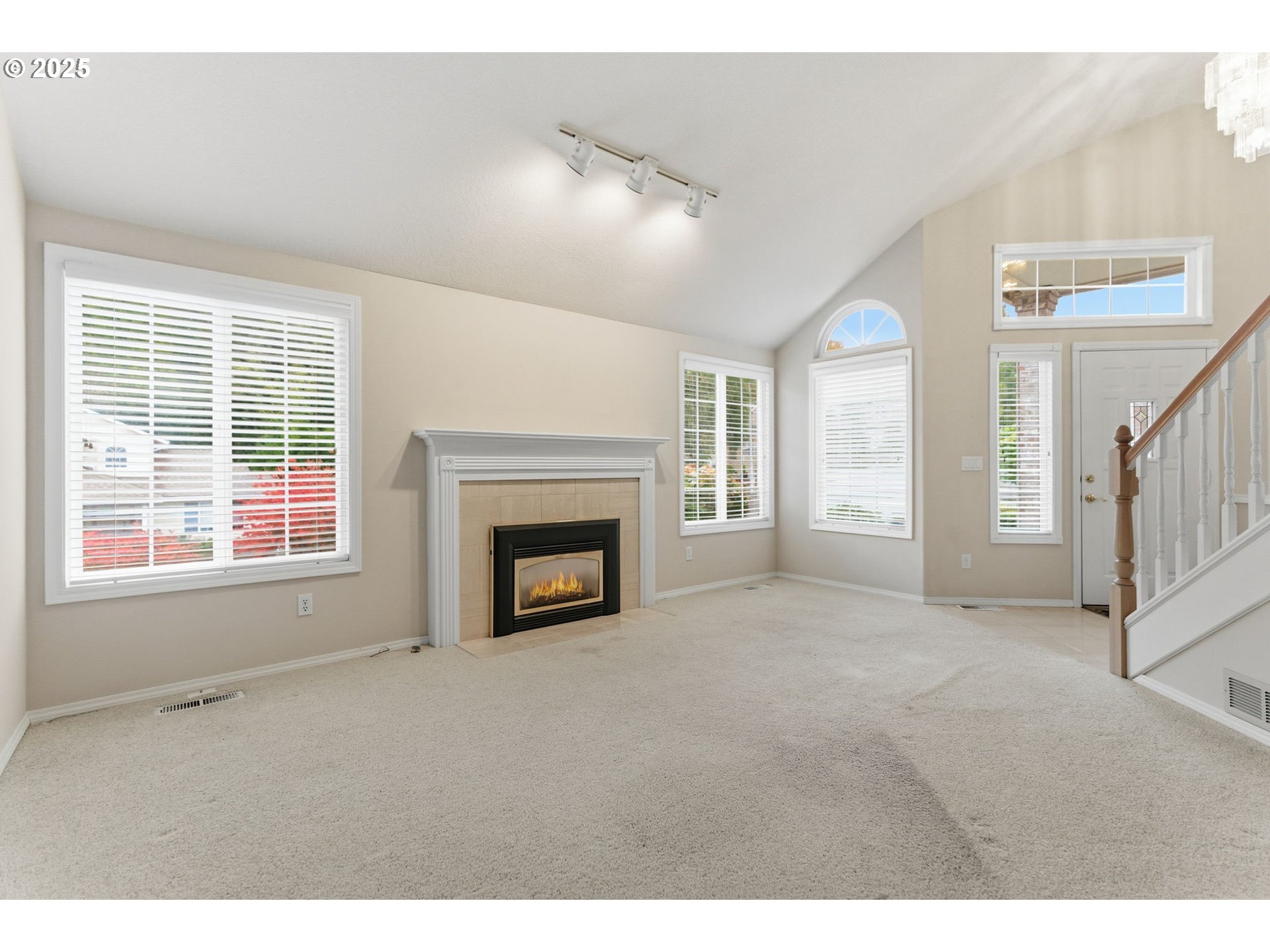 4753 Southeast 14th Street Gresham, OR 97080 - Photo 10 of 48 a view of an empty room with a fireplace and a window