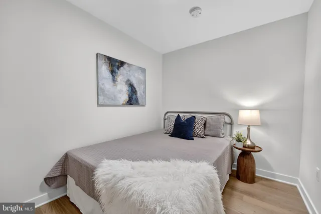 a bedroom with a bed and a table