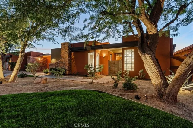 a view of a lush green hillside and a building in the background