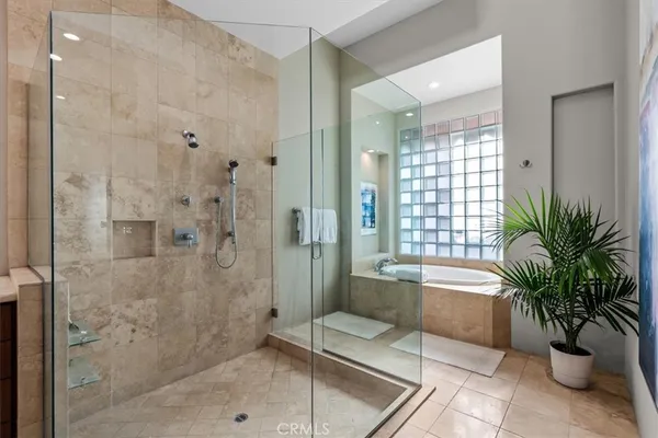 a bathroom with a sink double vanity granite and a mirror