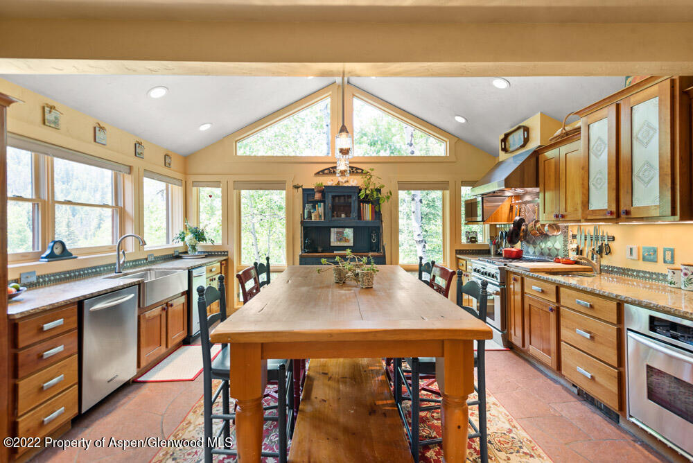 73 Juniper Court Marble, CO 81623 - Photo 17 of 47 a large kitchen with stainless steel appliances granite countertop a stove and cabinets