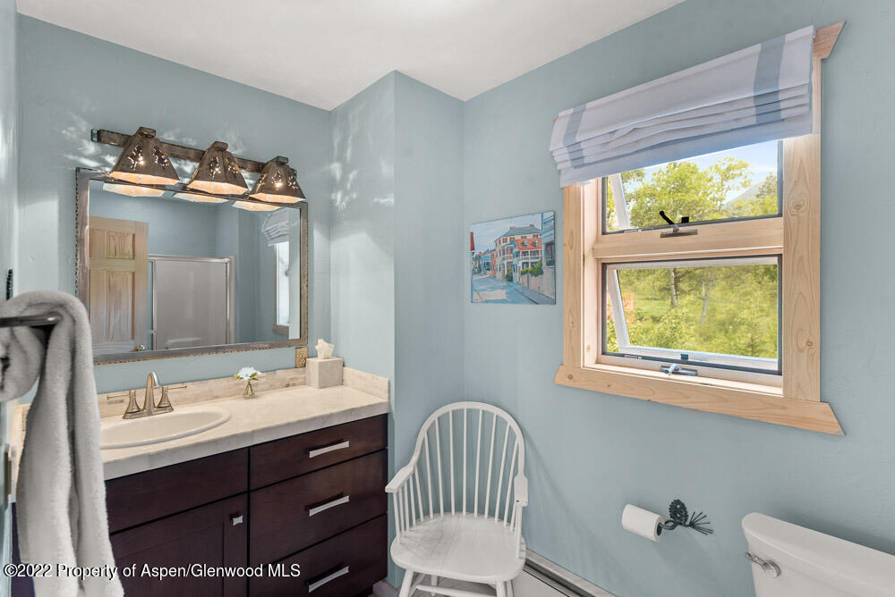 73 Juniper Court Marble, CO 81623 - Photo 26 of 47 a bathroom with a sink vanity and a mirror