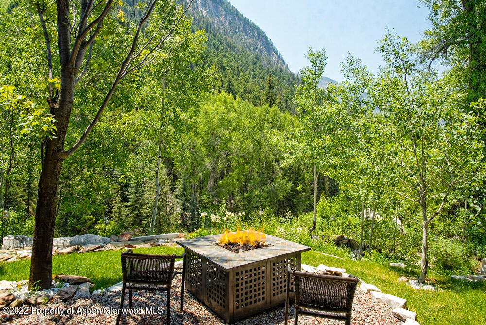 73 Juniper Court Marble, CO 81623 - Photo 40 of 47 a view of a chairs and table in the backyard
