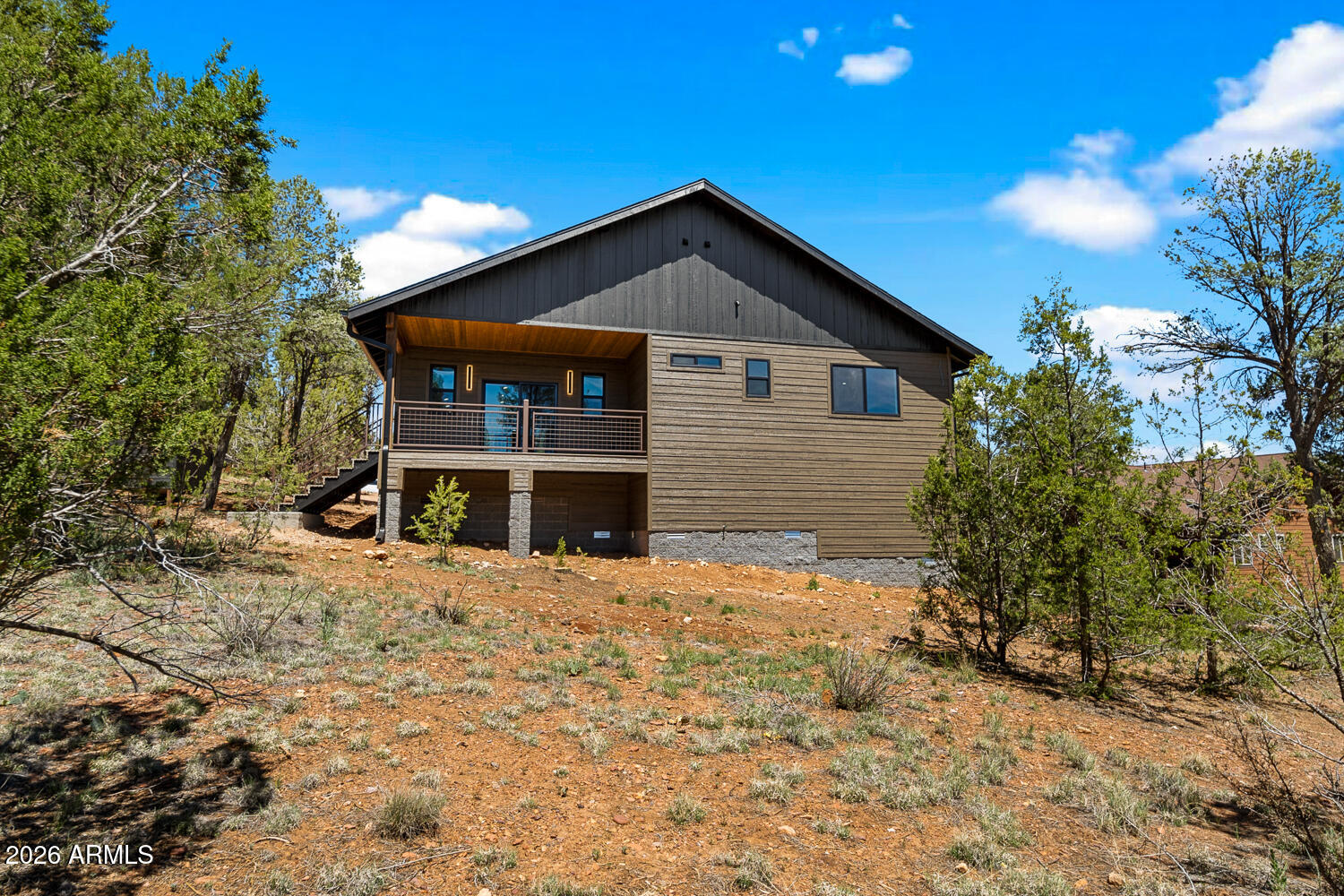 2235 Par Place Overgaard, AZ 85933 - Photo 12 of 42 a front view of a house with a yard