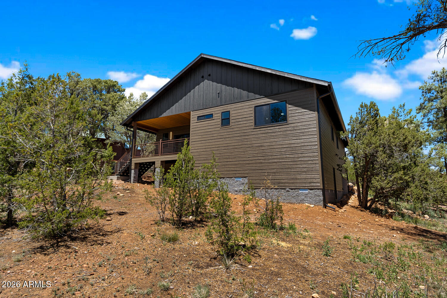 2235 Par Place Overgaard, AZ 85933 - Photo 13 of 42 a front view of a house with a yard