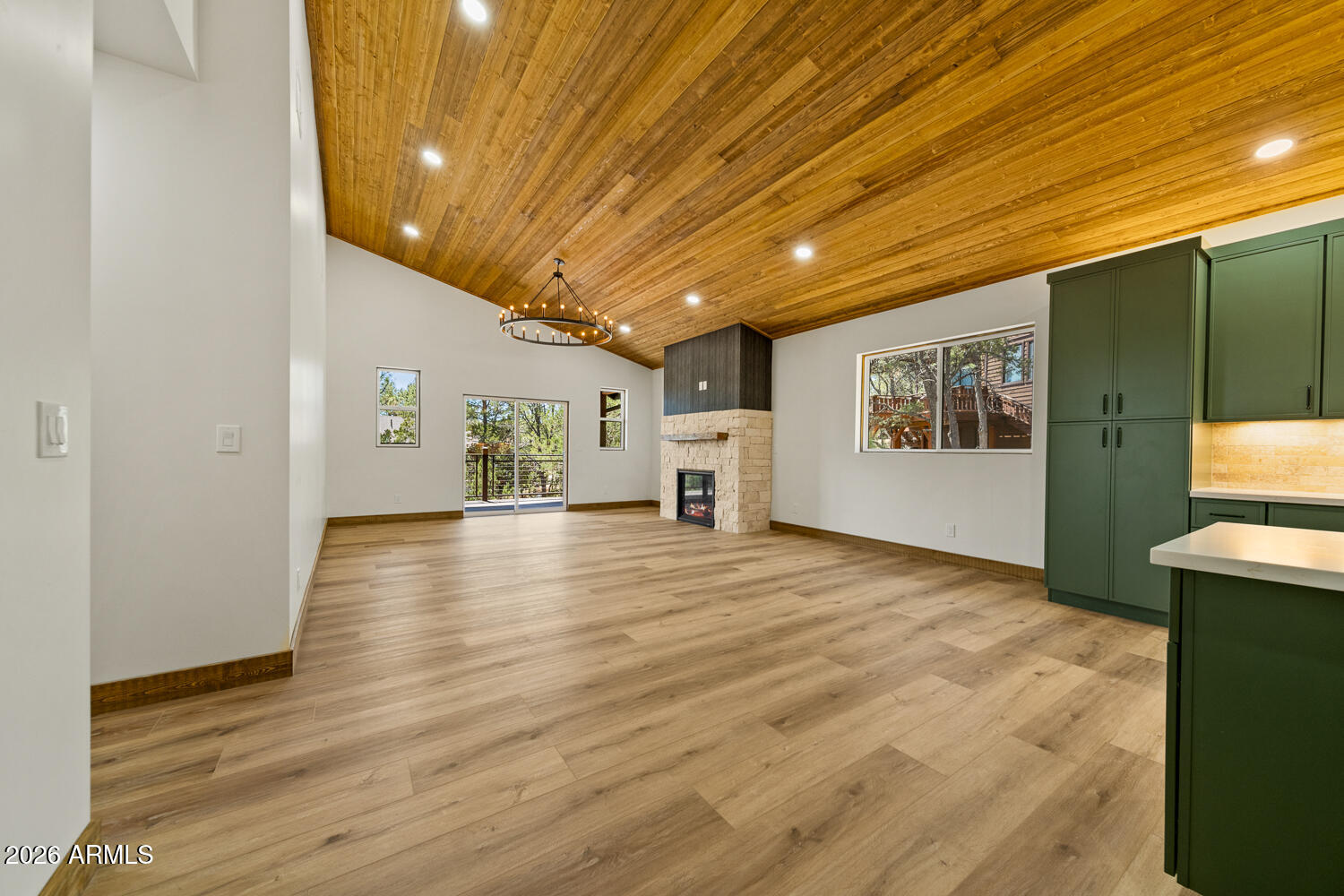 2235 Par Place Overgaard, AZ 85933 - Photo 14 of 42 a view of empty room with wooden floor and window