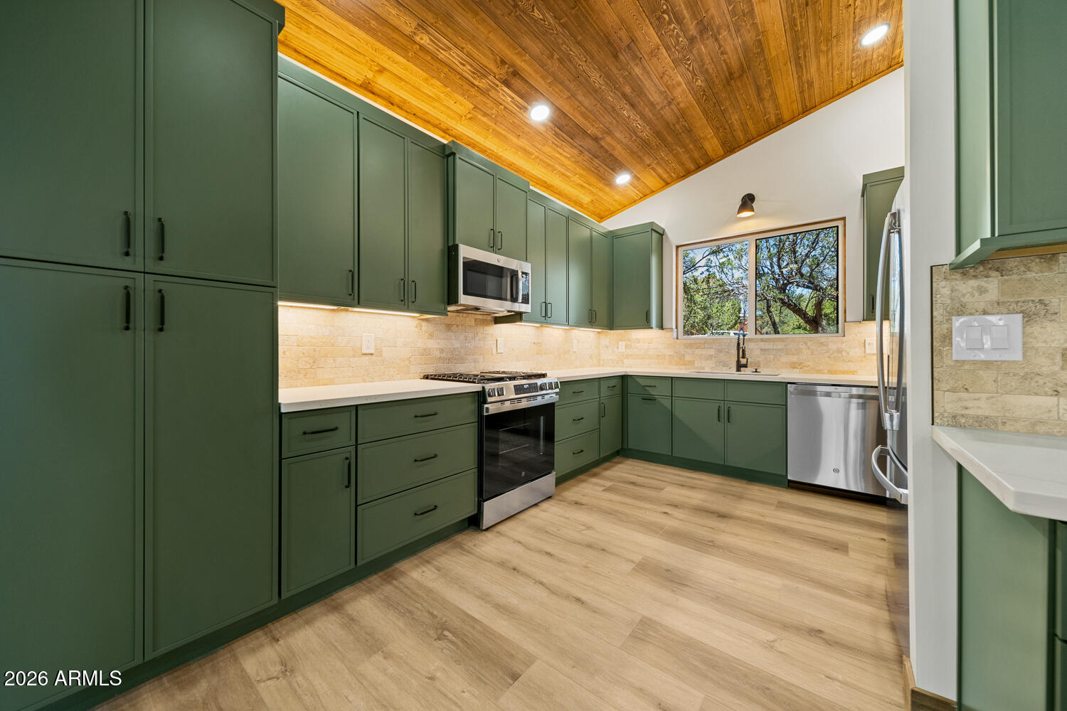 2235 Par Place Overgaard, AZ 85933 - Photo 15 of 42 a kitchen with a sink and cabinets