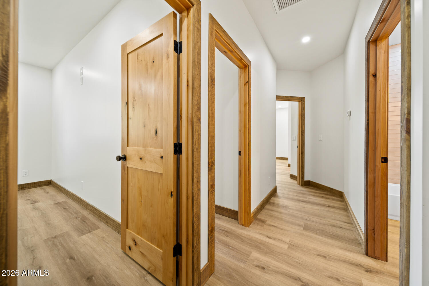 2235 Par Place Overgaard, AZ 85933 - Photo 22 of 42 a view of a hallway with wooden floor and staircase
