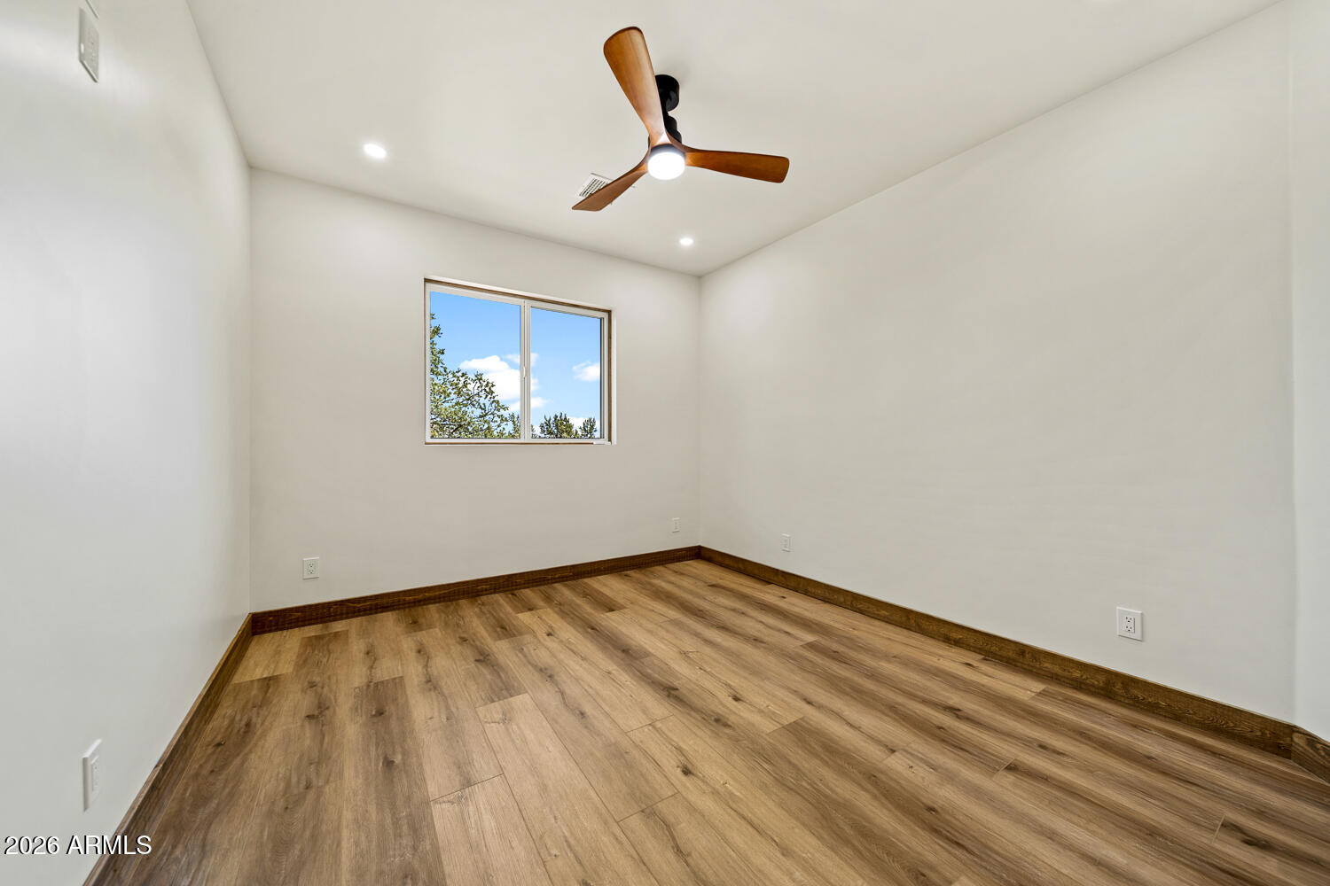 2235 Par Place Overgaard, AZ 85933 - Photo 25 of 42 a view of empty room with wooden floor
