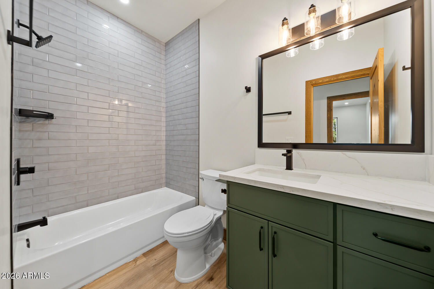 2235 Par Place Overgaard, AZ 85933 - Photo 27 of 42 a bathroom with a toilet a sink a bathtub and a mirror